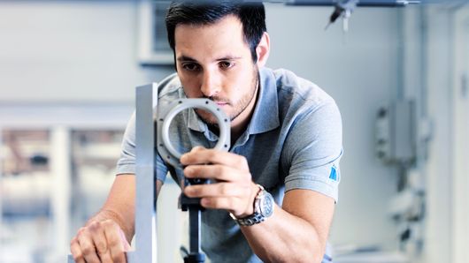 TRUMPF employee testing a component